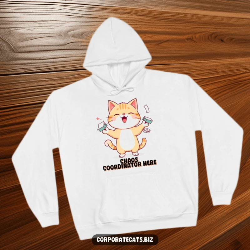 Funny hoodie depicting a cheerful cat character in the act of juggling many small paper stacks, radiating playful energy and office vibes.