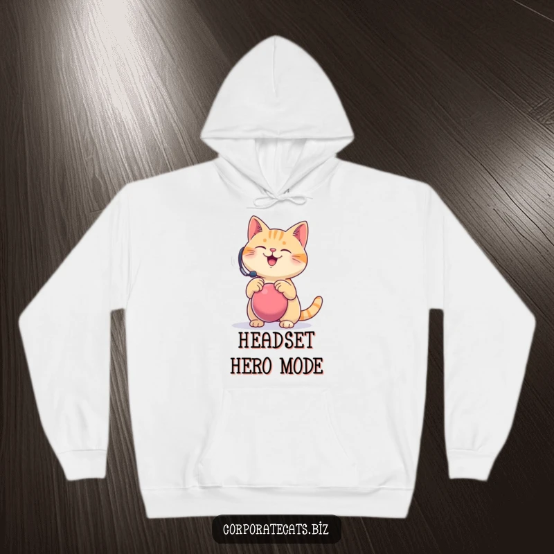 Funny hoodie design, a happy cat wearing a headset comically bounces a stress ball, ideal for cozy stress relief and humor.